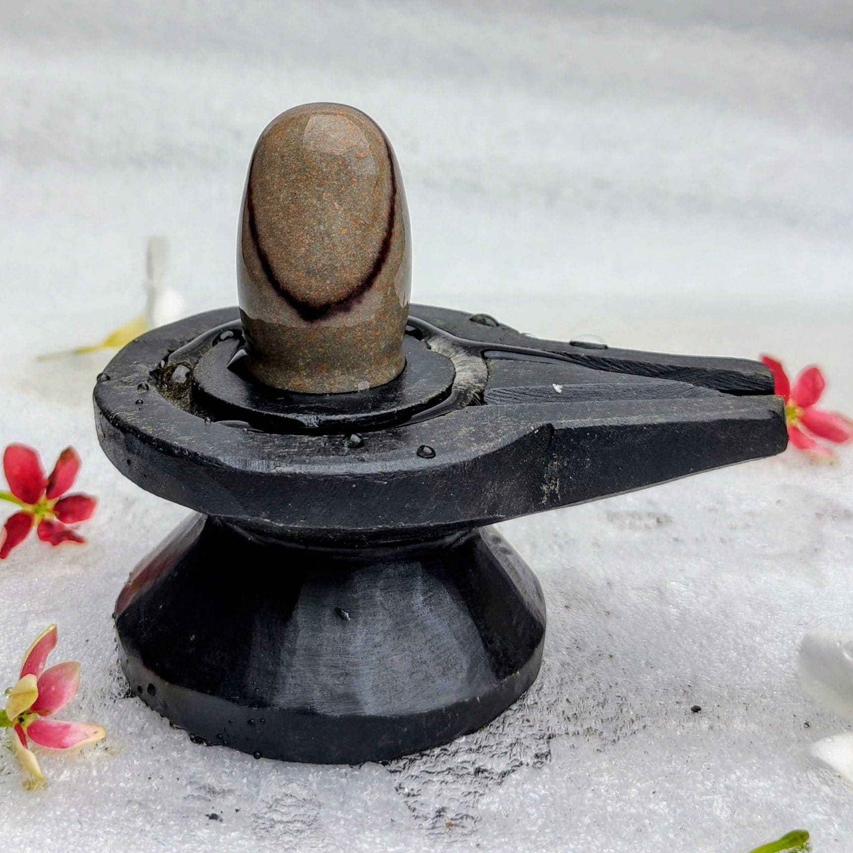 2026/08/82130.jpg 2" Inches Narmada Shivling with Damru Shape Jaladhari(Base) for Home - Image 1